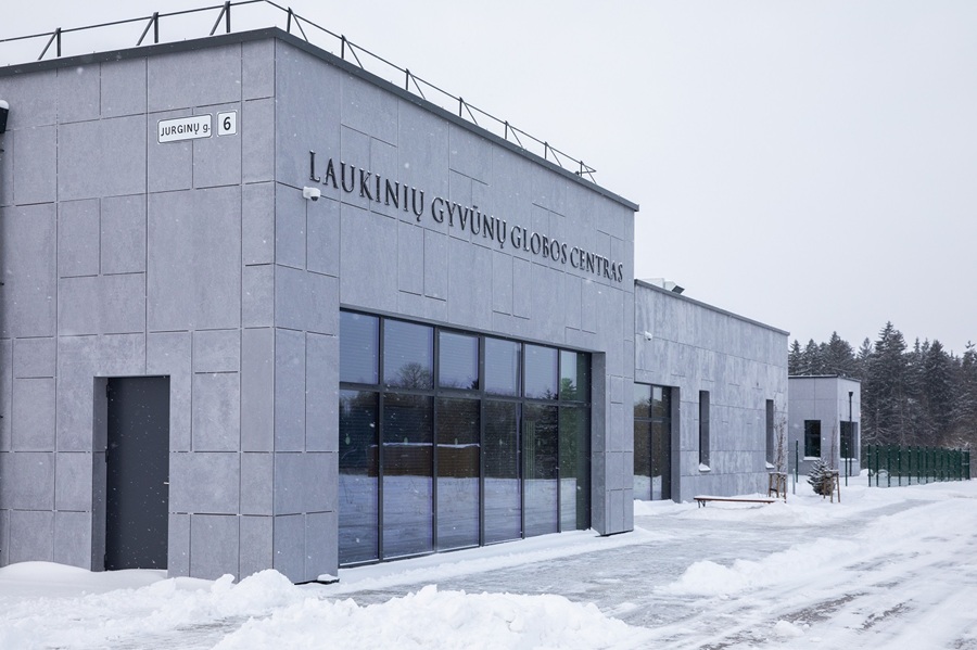 Facade of a purple building in snow